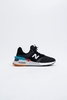 New Balance - Sortlicher und atmungsaktiver Sneaker in schwarz mit mehrfarbiger Gummisohle -MS997XTD