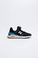 New Balance - Sortlicher und atmungsaktiver Sneaker in schwarz mit mehrfarbiger Gummisohle -MS997XTD