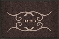 Braune Schmutzfangmatte mit Ornament und Text