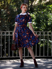 1950er Jahre Retro-Kleid Dark Navy Printed Irregular Poms Ärmelloses Turndown-Halsband Rockabilly-Kleid