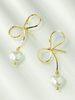 Ohrringe Blond Bogen Perlen Zinklegierung Chic Runde Brilliant Imitation Perle Ohrstecker Frauen Schmuck