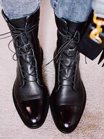 Schwarze flache Stiefeletten mit runder Spitze und Schnürung für Damen