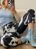 Schwarze Hose für Frauen Kuhmuster Polyester natürliche Taille geometrische Hose
