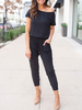 Schwarzer lässiger Overall Bateau-Ausschnitt Kurzarm Baumwolle Tapered Fit Sommer One Piece Outfit
