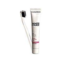 Curaprox White Is Black Whitening Zahnpasta mit Zahnbürste